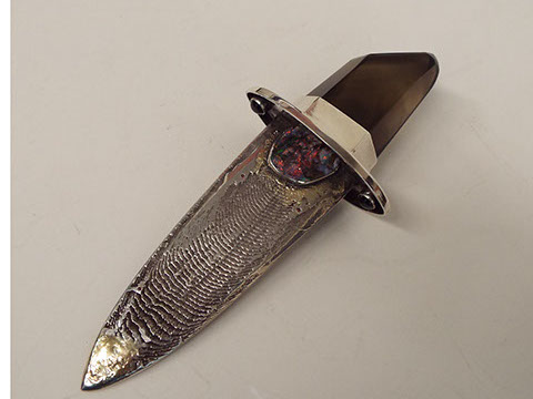 smoky quartz handled knife with sterling silver blade, cuttlebone casting, with stones: raw opal, garnet, small emerals, small rubies in knife 